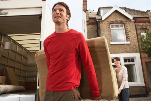 Local commercial relocation team managing office furniture and boxes