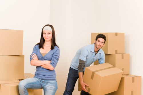 Local moving team navigating stairs and access challenges
